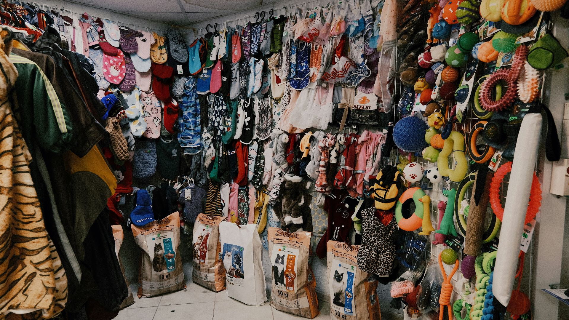 assorted clothes on white steel rack