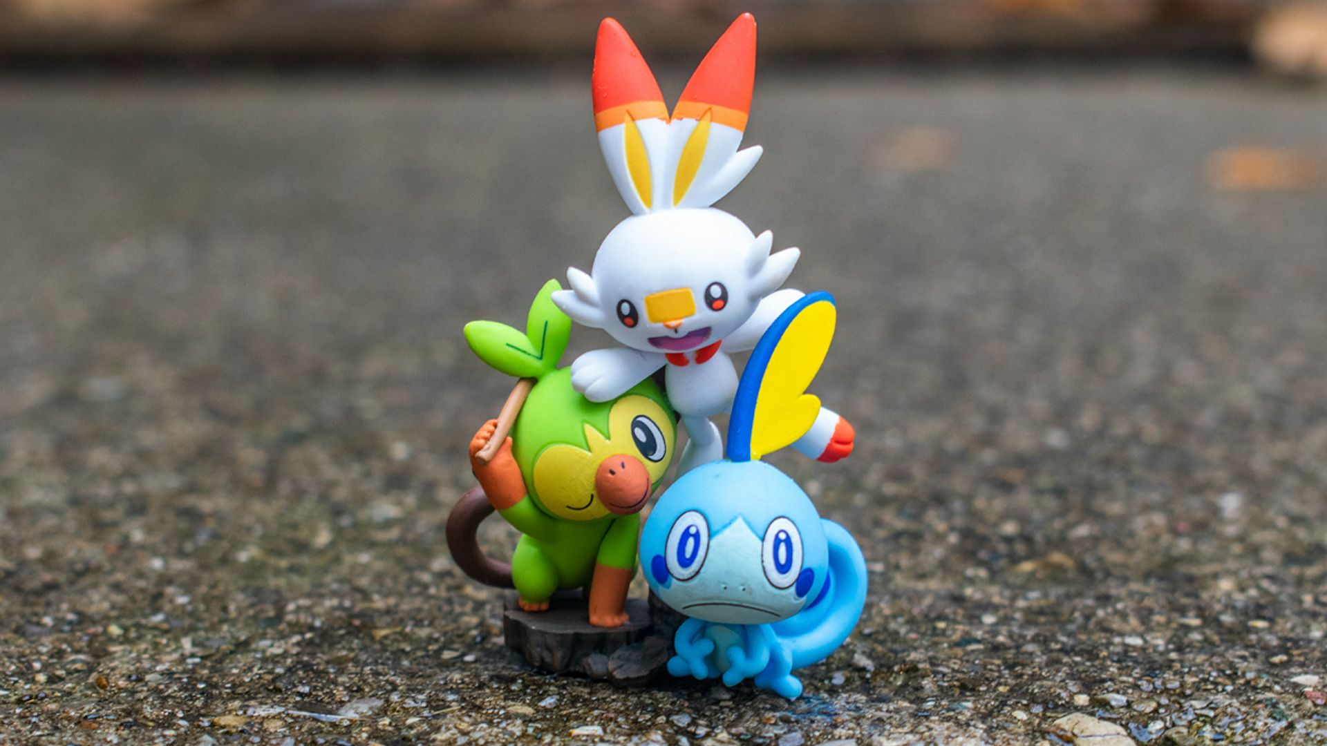 a group of pokemon figurines sitting on top of a rock