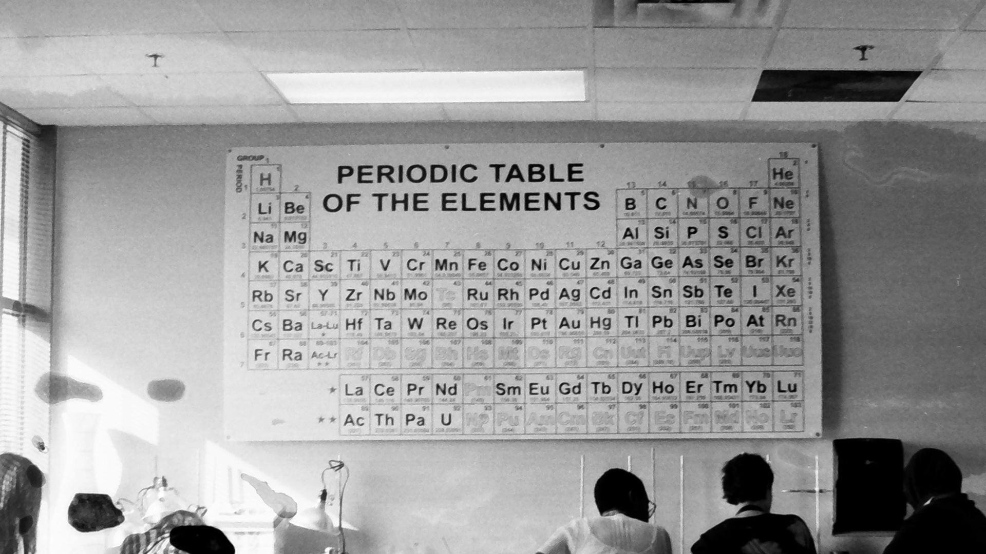 a group of people sitting around a table