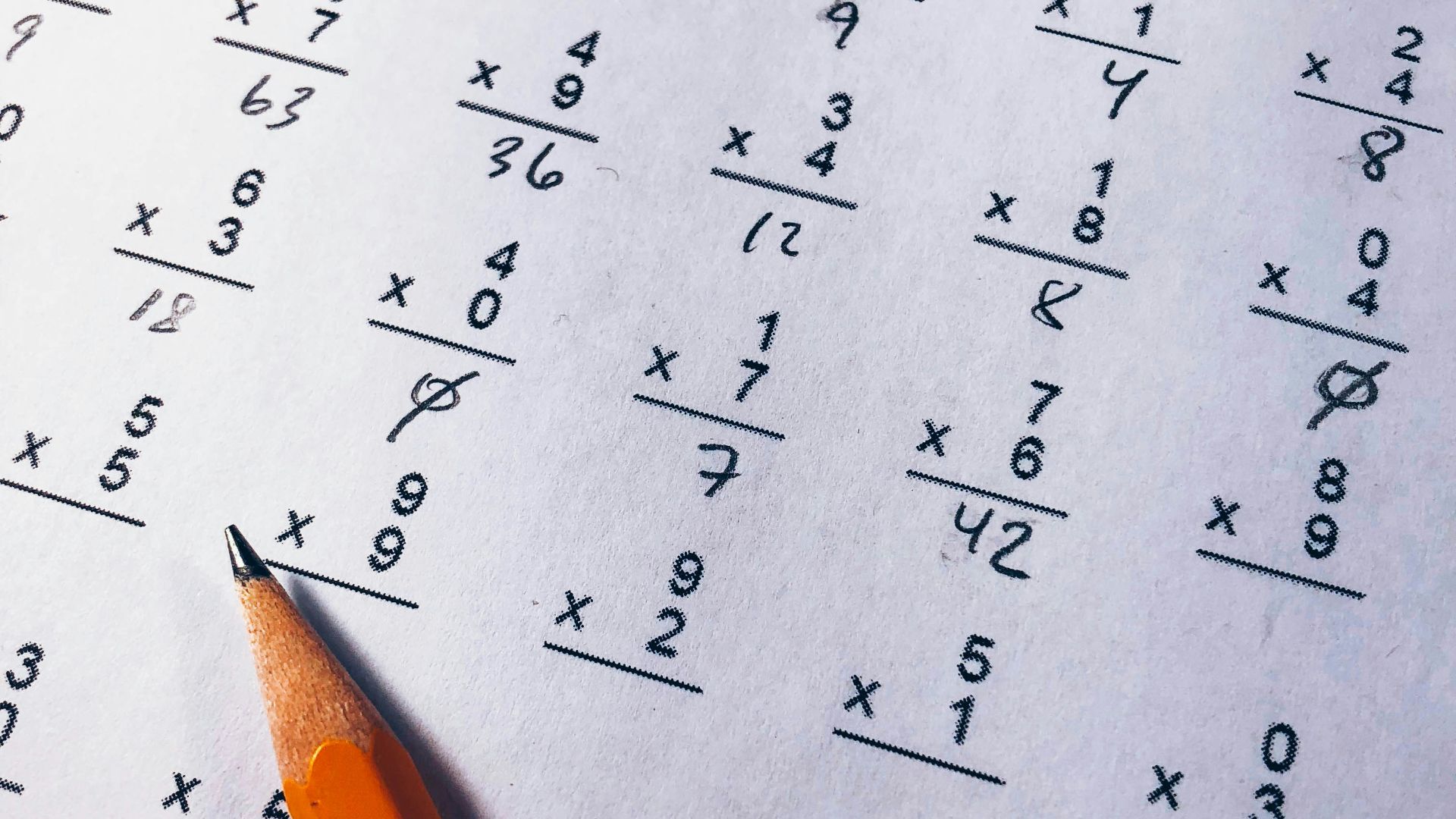 brown pencil on equation paper