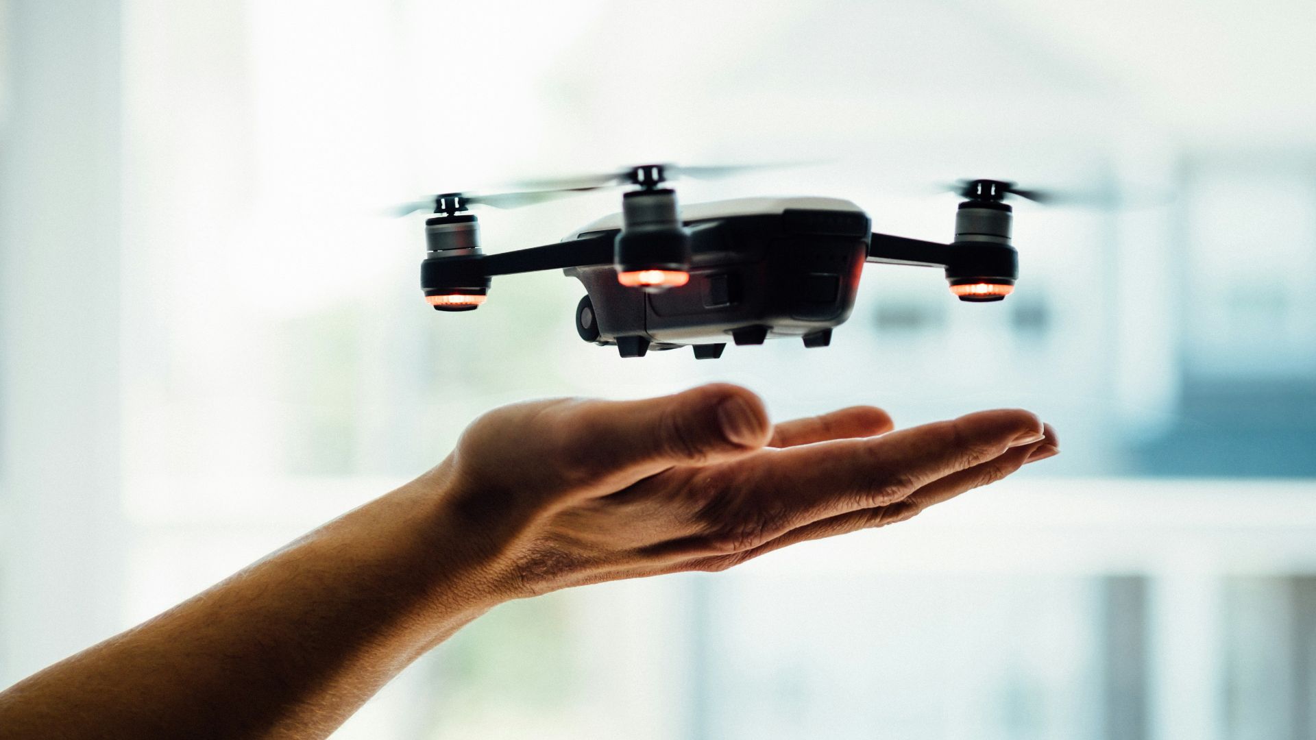 turned on black quadcopter drone