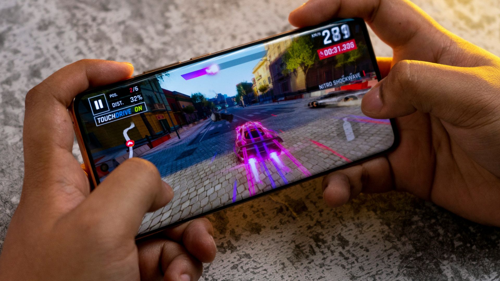 a person playing a game on a cell phone