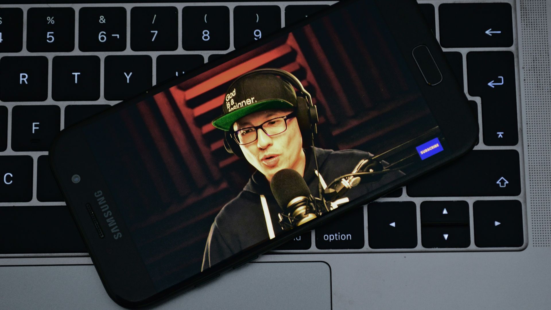 black Samsung Galaxy smartphone on grey laptop