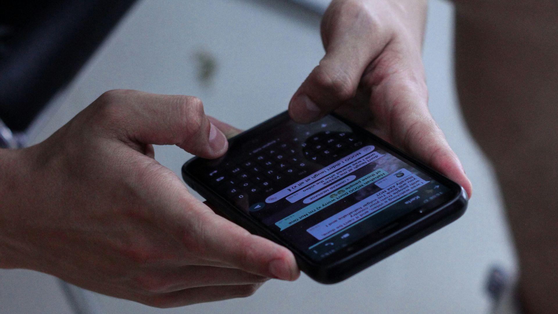 person holding black iphone 4