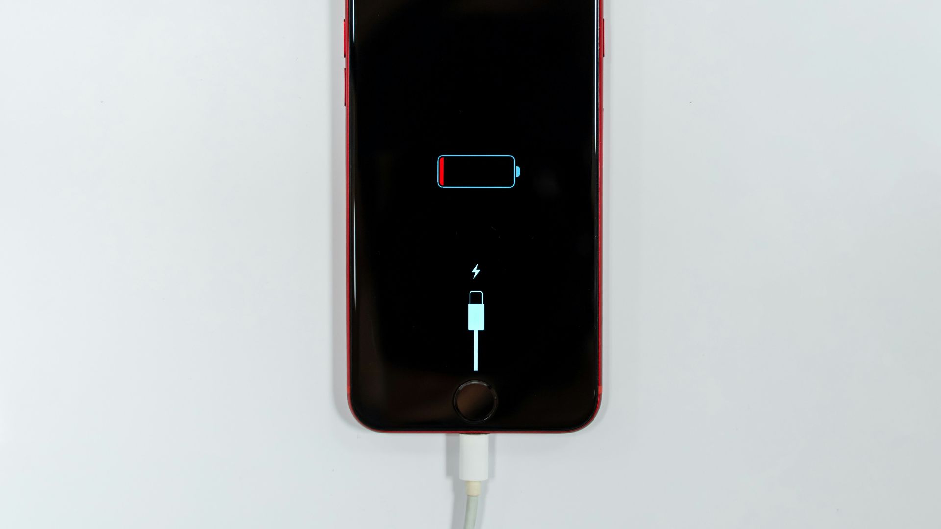 black iphone 5 on white surface