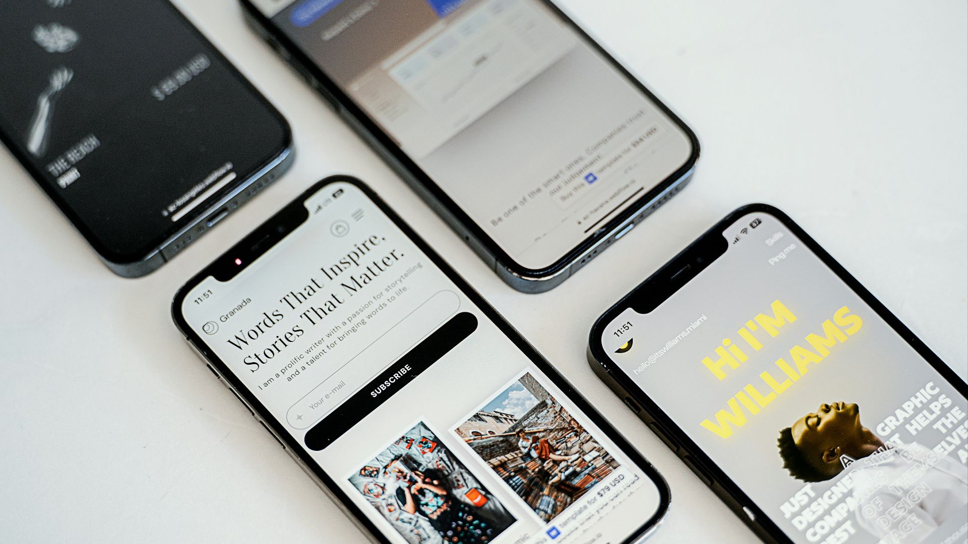 three different cell phones sitting next to each other