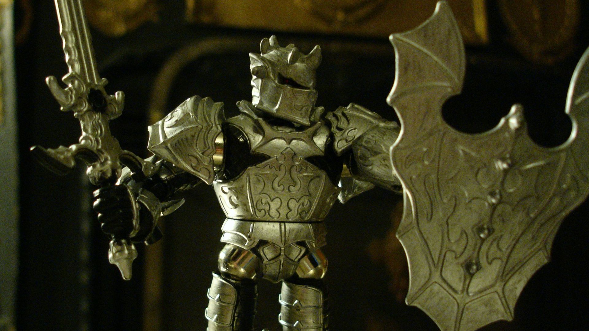 a toy figurine of a knight holding a sword