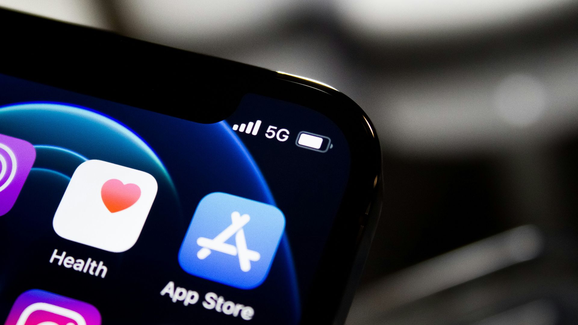 black iphone 4 displaying icons