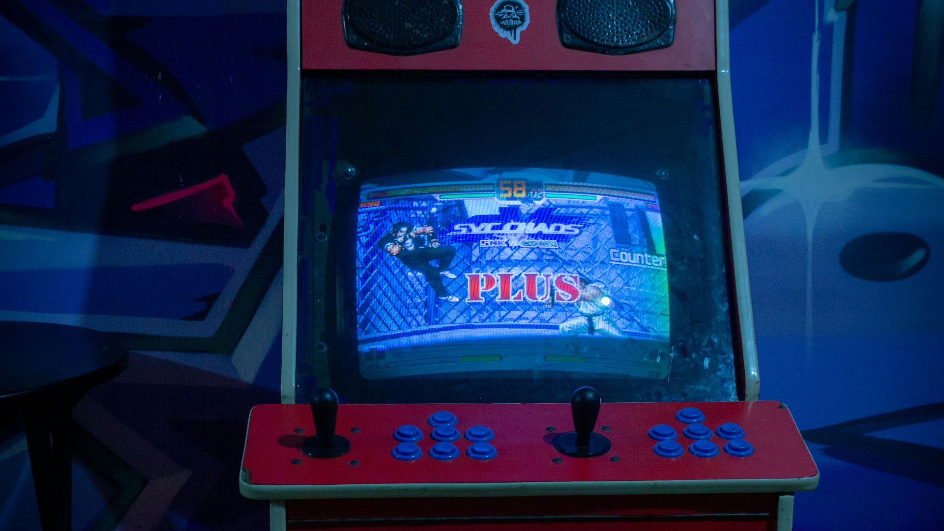 a video game machine sitting on top of a tile floor