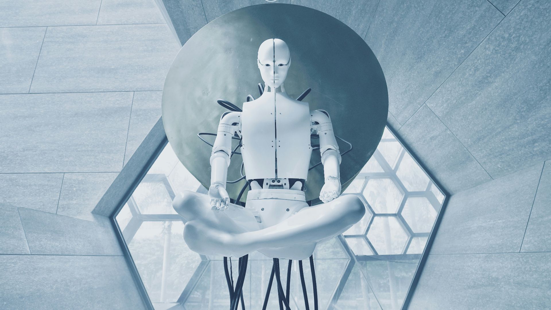 man in black jacket sitting on white chair