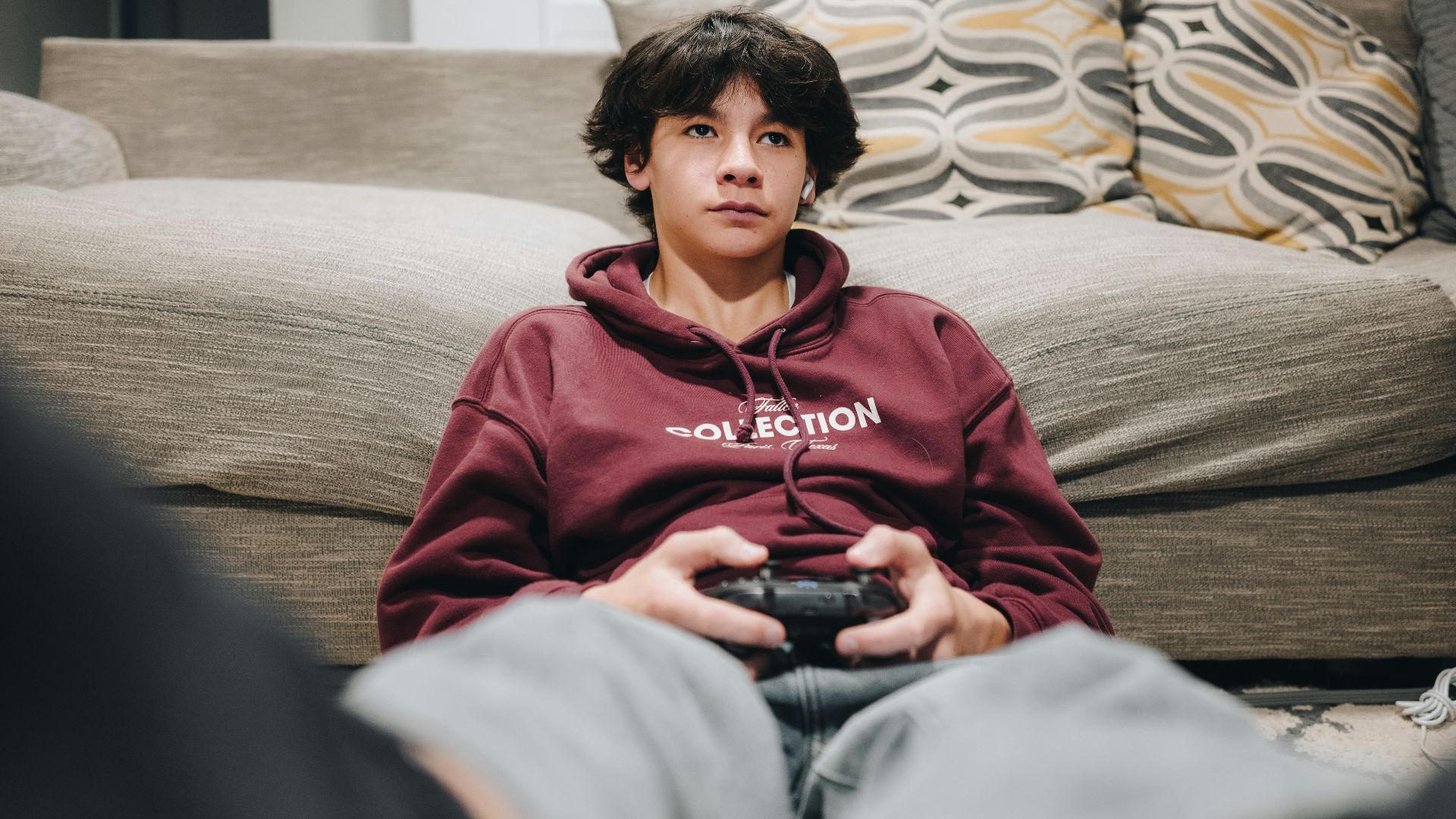 A young boy is playing a video game.