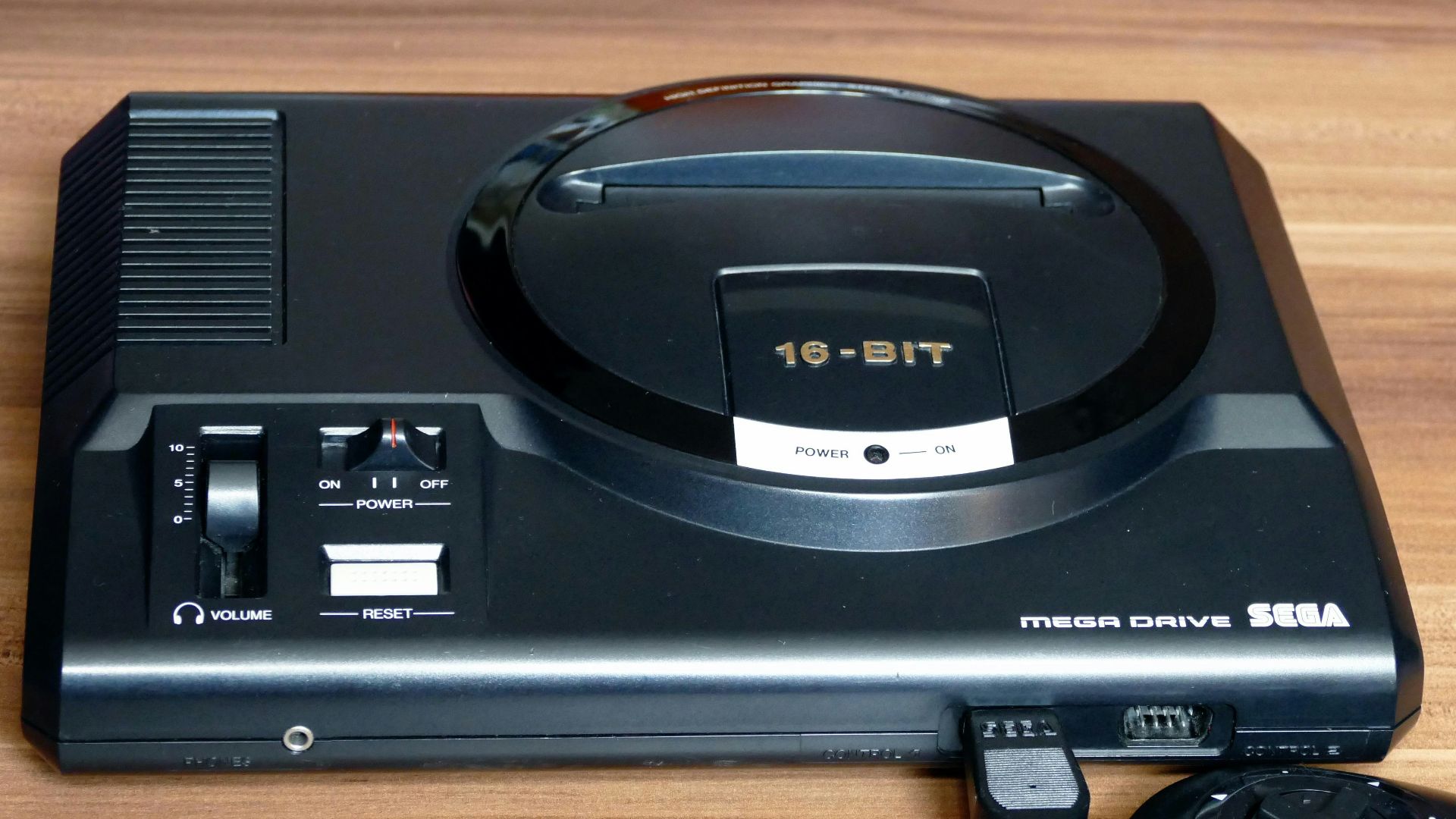 a video game system sitting on top of a wooden table