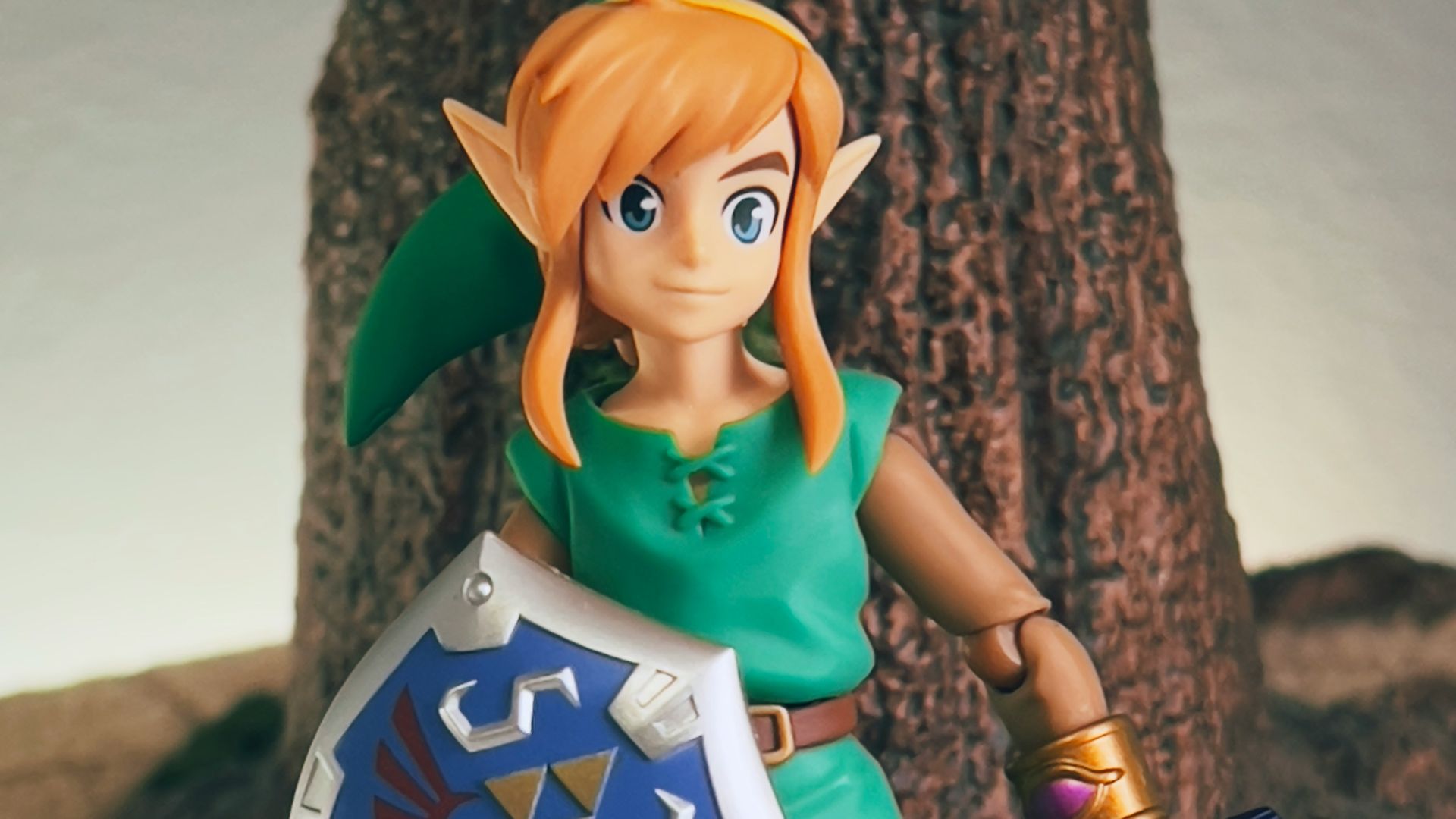 a toy girl holding a sign