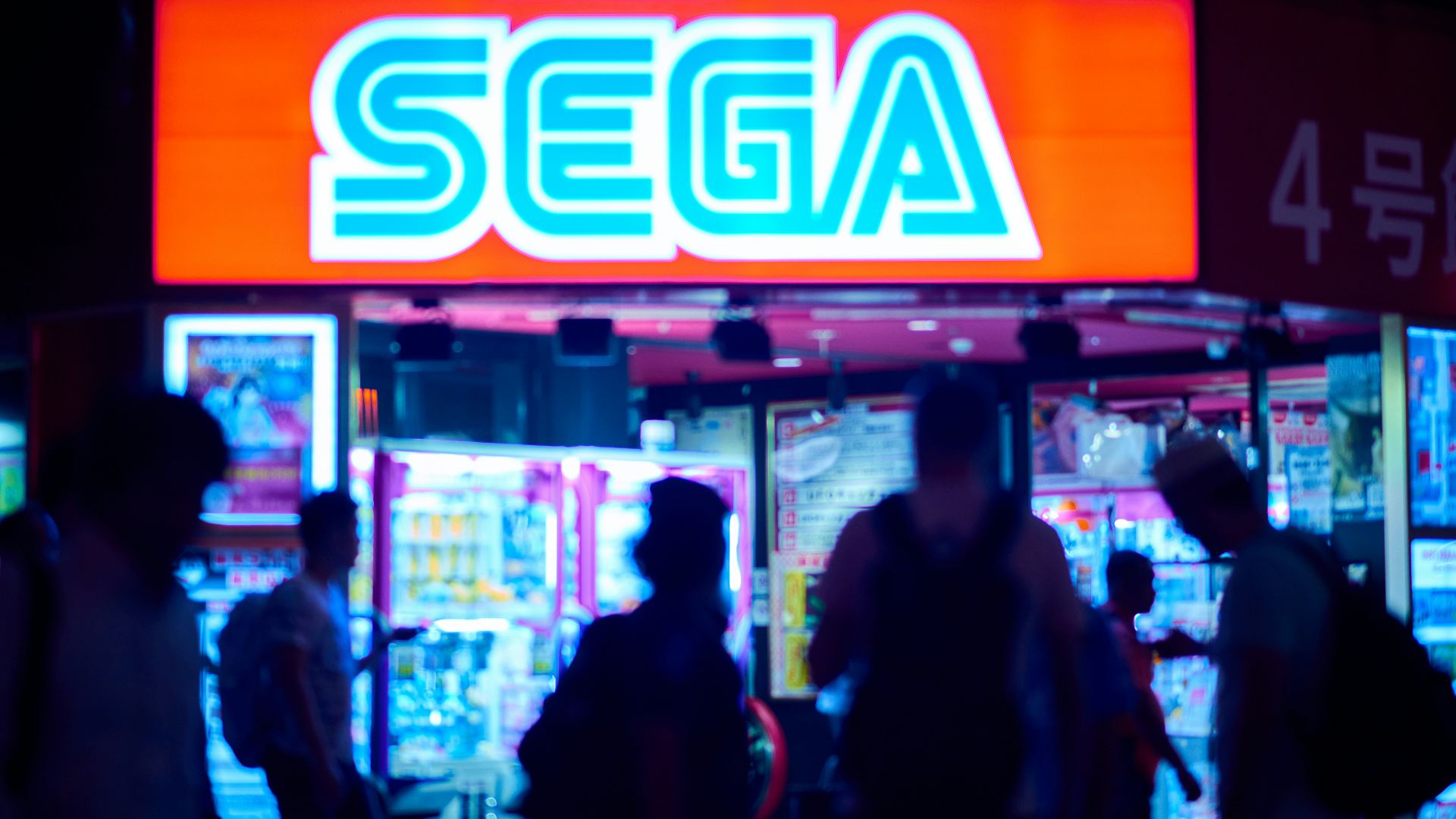 people standing near red and white open neon signage