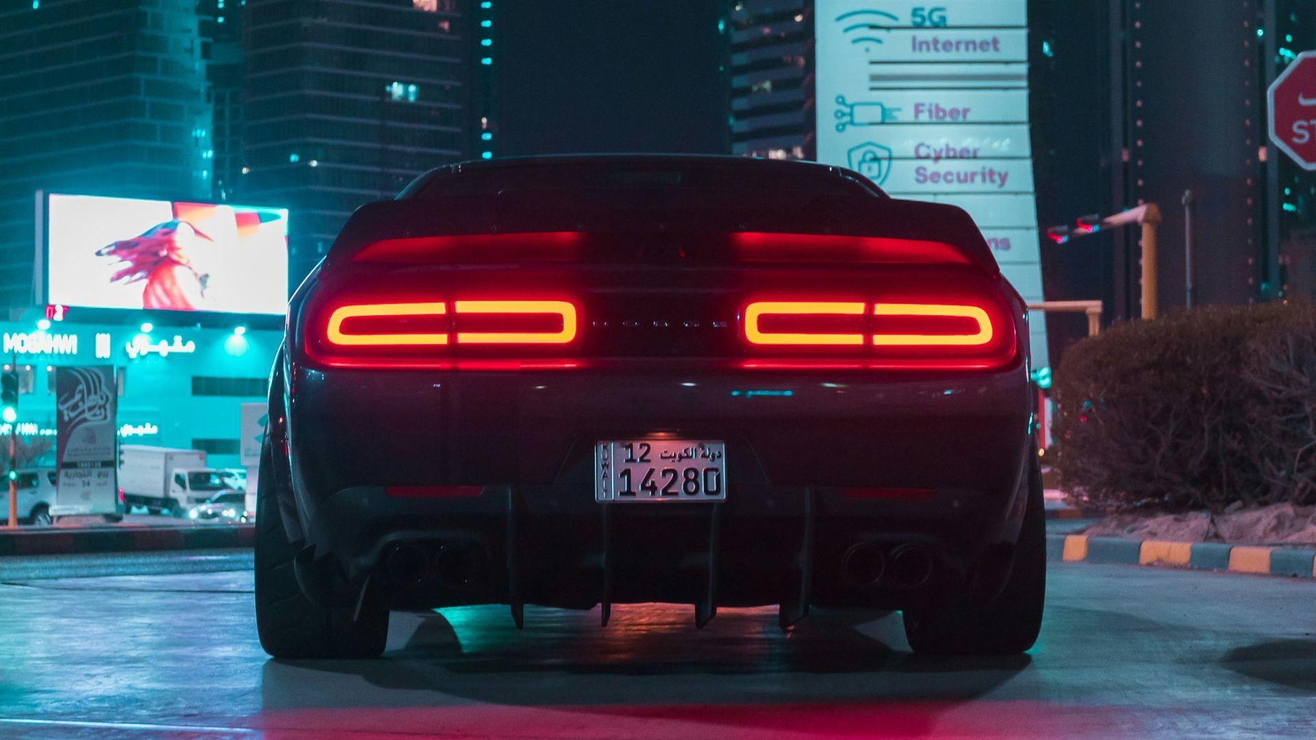 a car parked in a parking lot at night