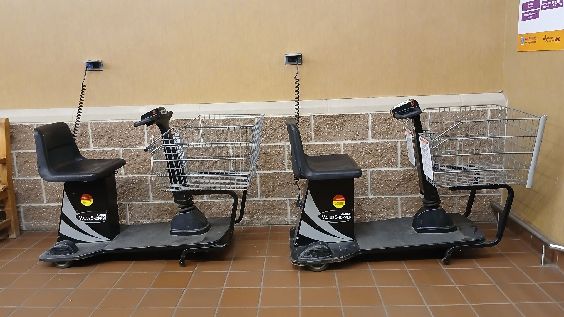 File:Motorized shopping carts charging for the night, Wegmans (95091).jpg
