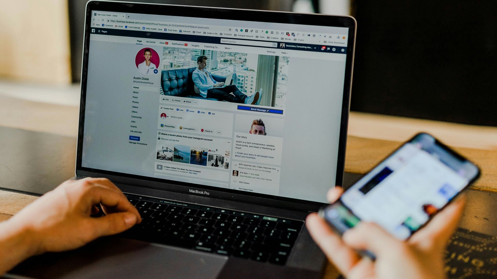 person using both laptop and smartphone