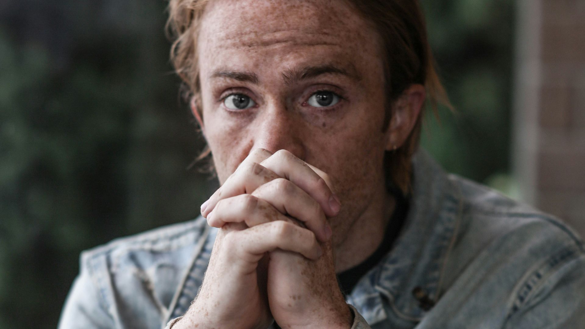 man in gray-washed denim jacket
