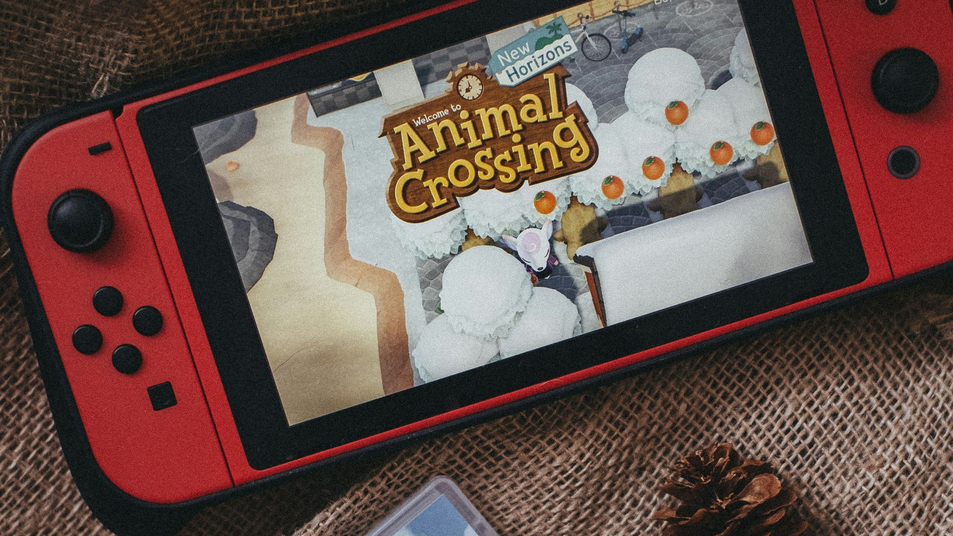 a nintendo wii game sitting on top of a blanket