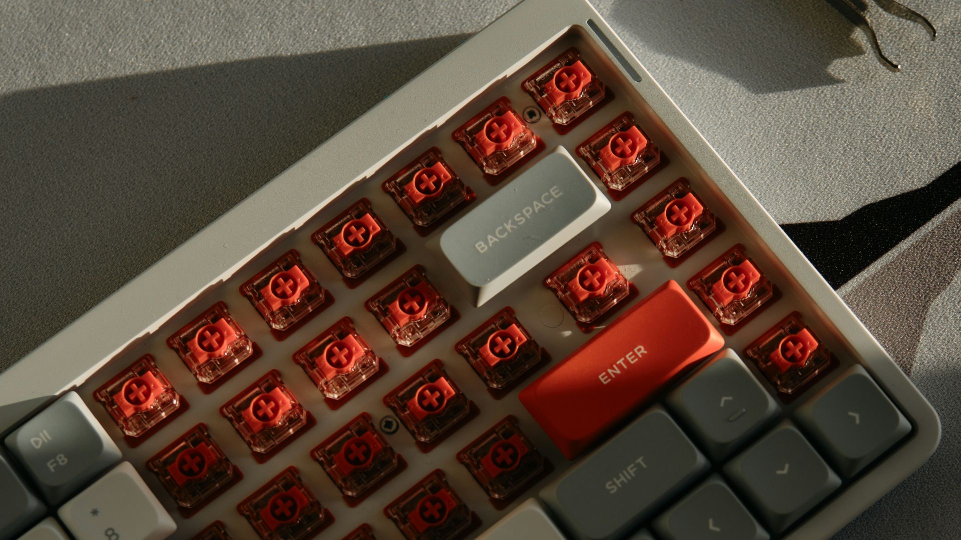 A computer keyboard sitting on top of a table