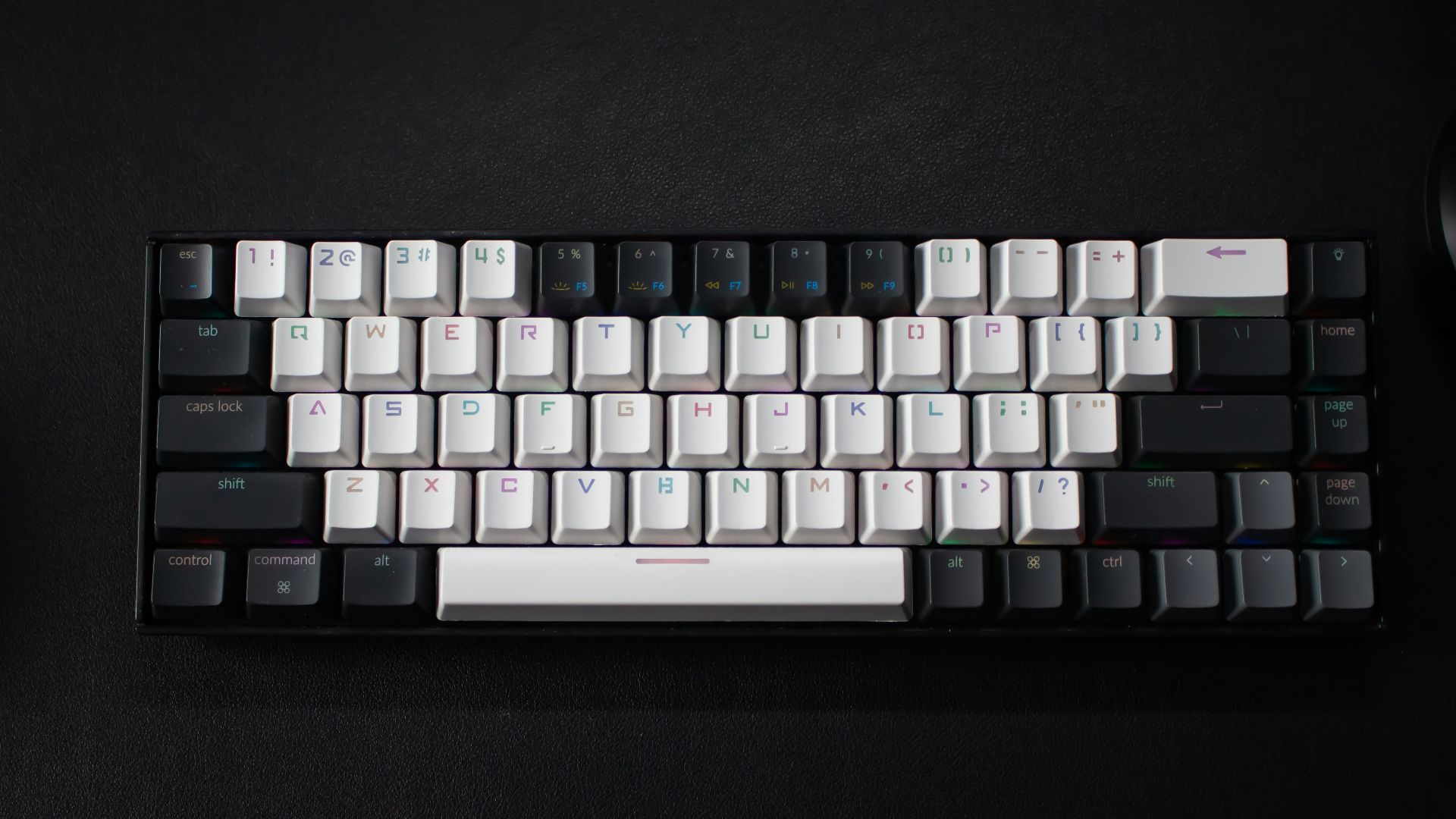 a keyboard and a mouse on a black surface