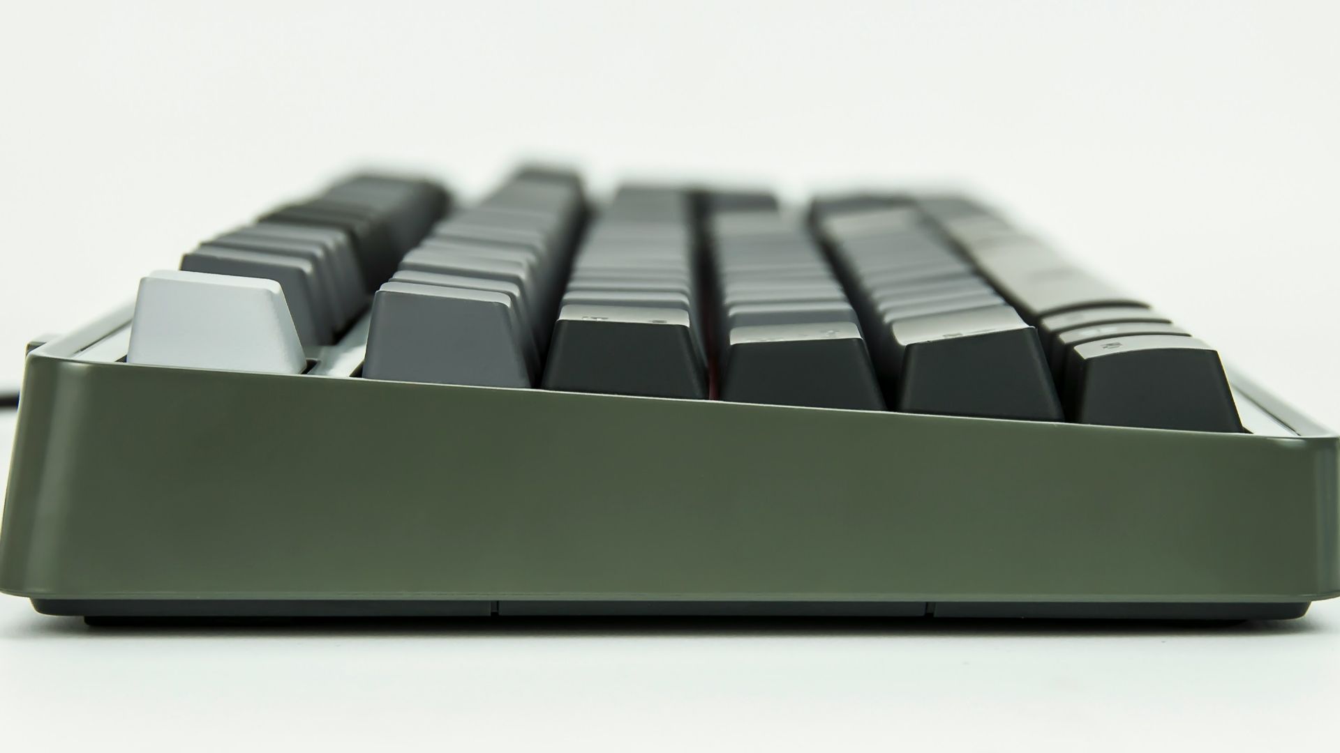 selective focus of black and gray corded computer keyboard