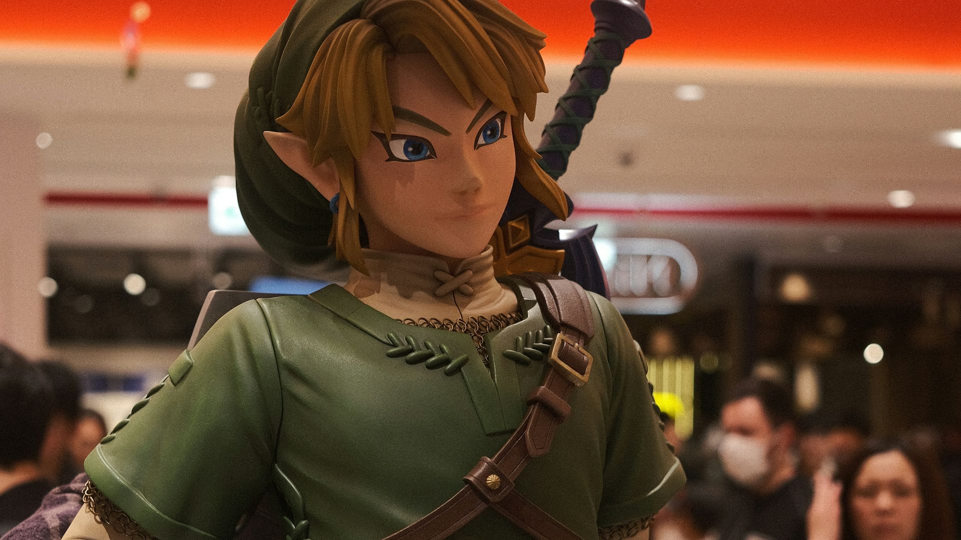 a statue of a woman in a green outfit