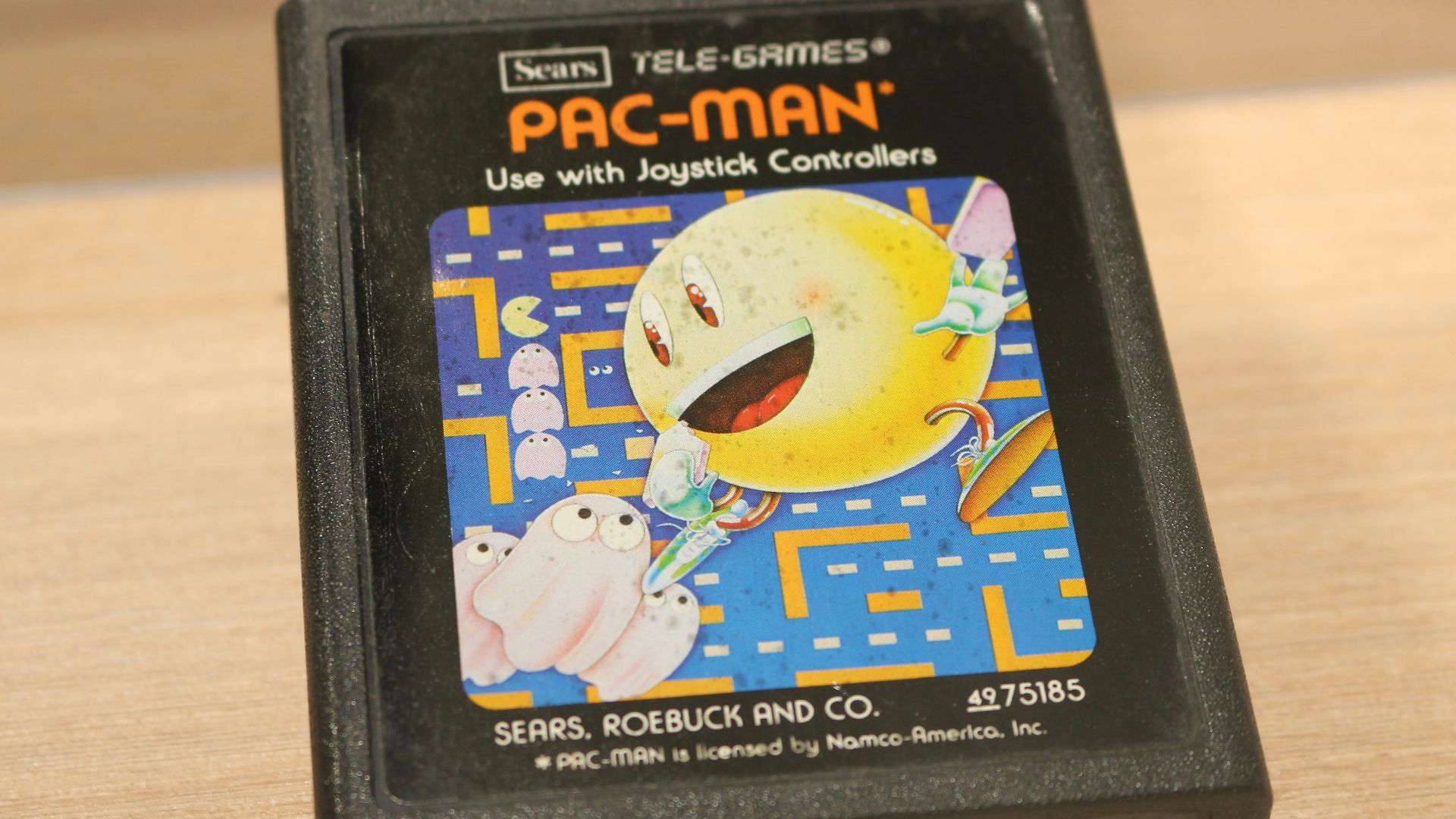 A video game sitting on top of a wooden table