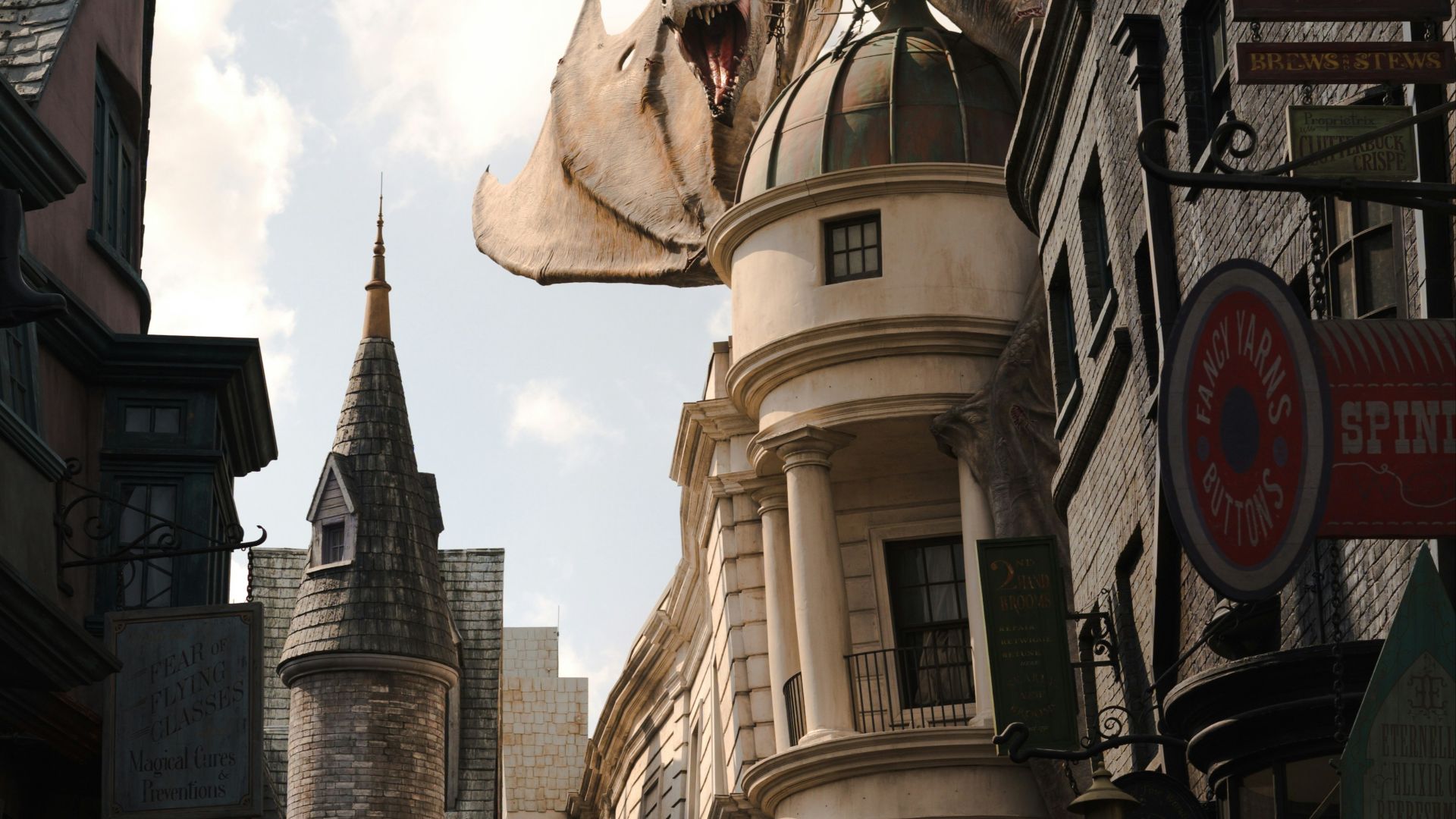 a crowd of people walking down a street next to tall buildings