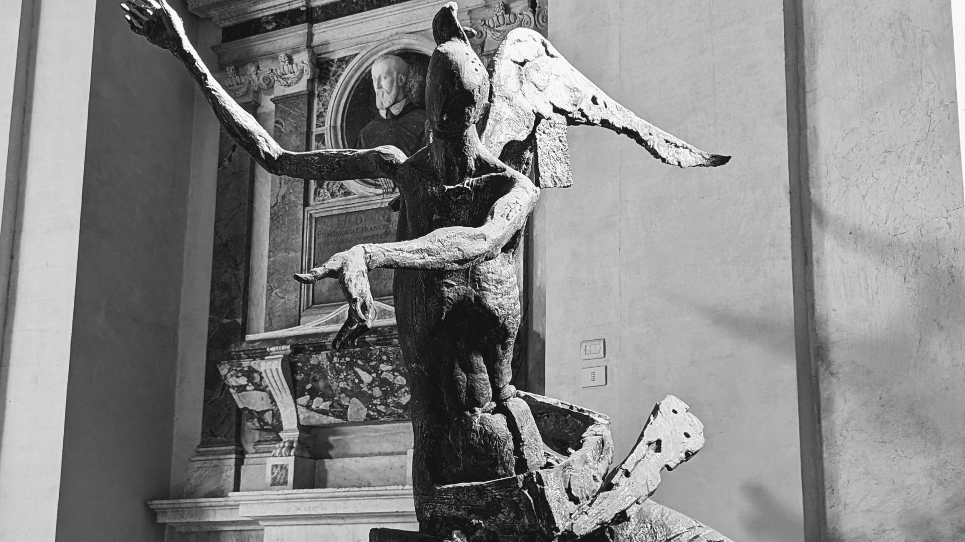 a black and white photo of a statue
