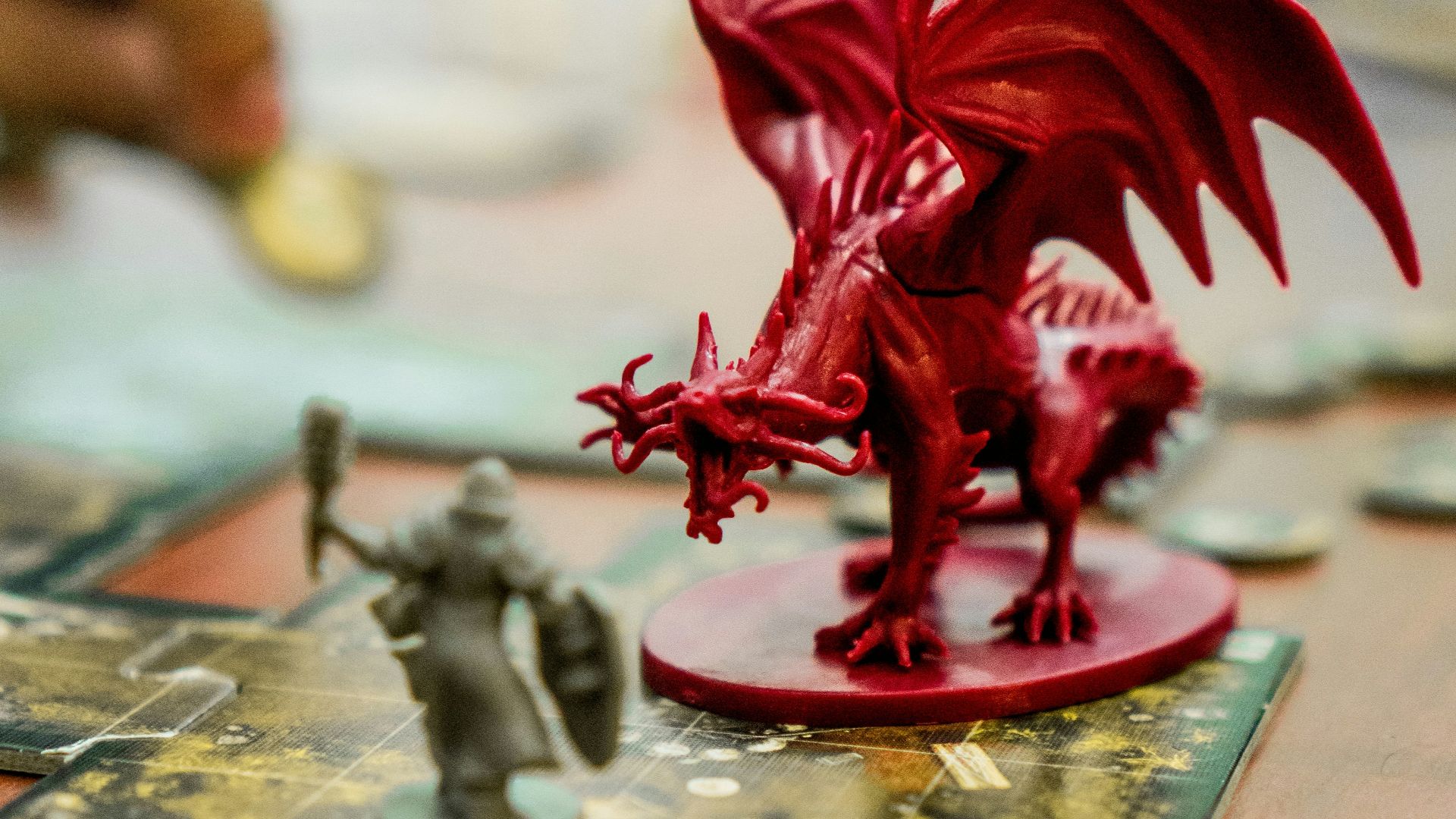 red dragon action figure on table