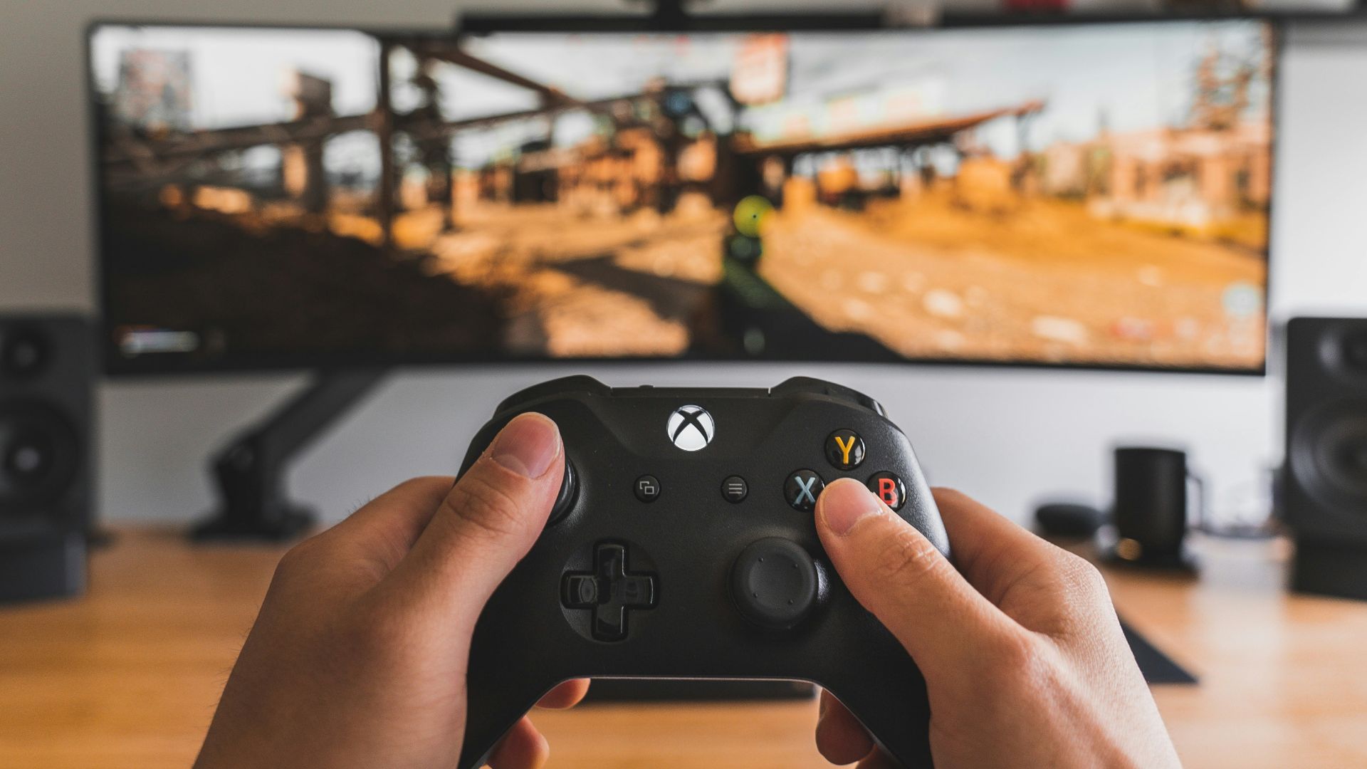 person holding black game controller