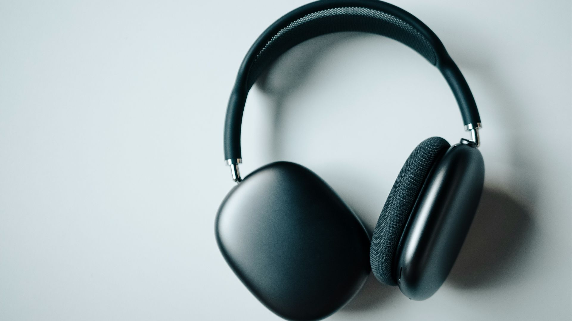 black wireless headphones on white desk