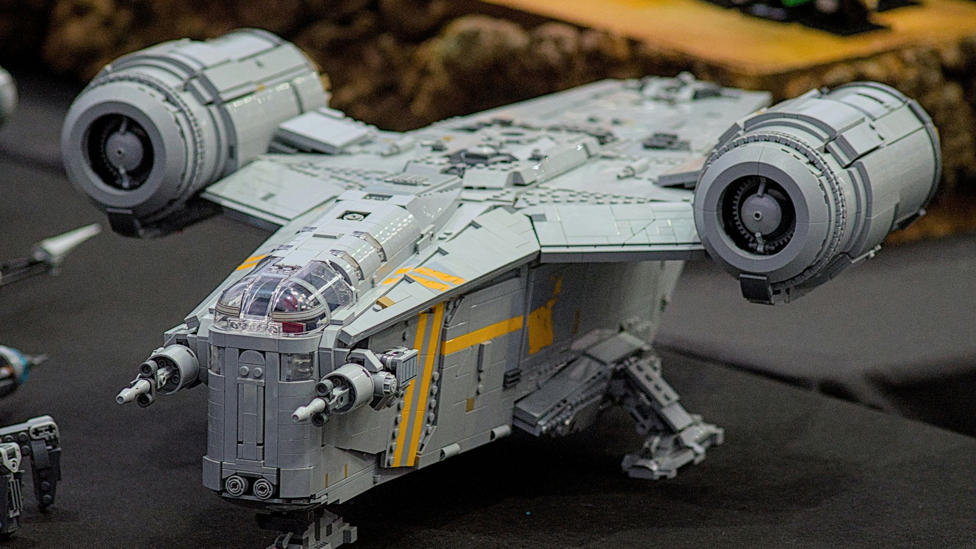 a model of a star wars fighter plane on a table