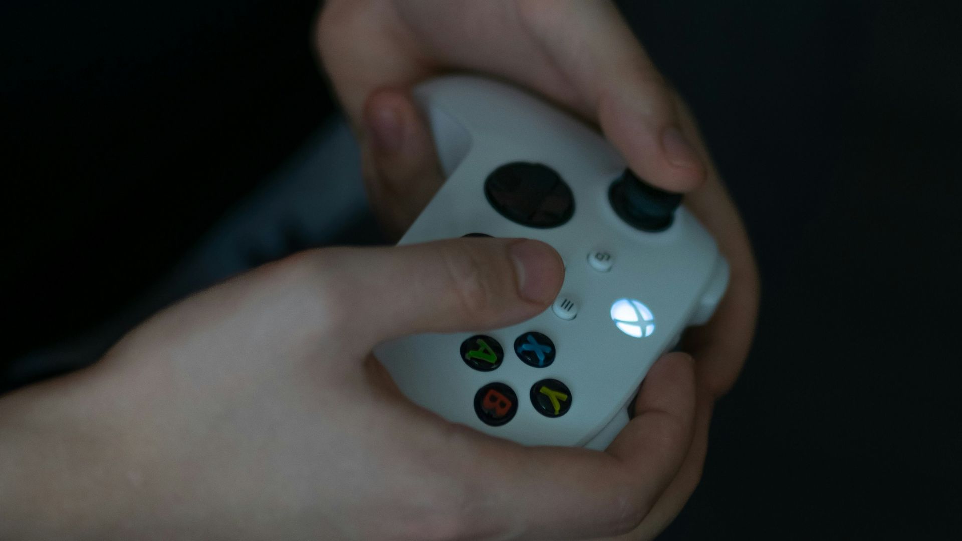 a close up of a person holding a remote control