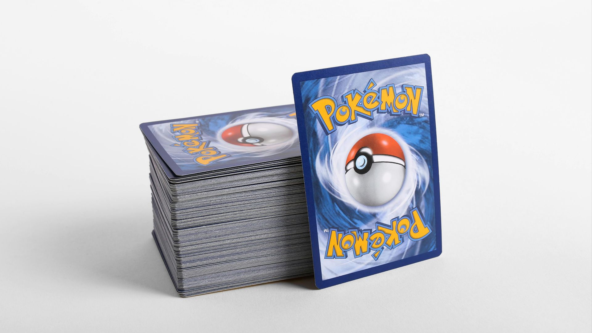 a stack of pokemon cards sitting on top of each other