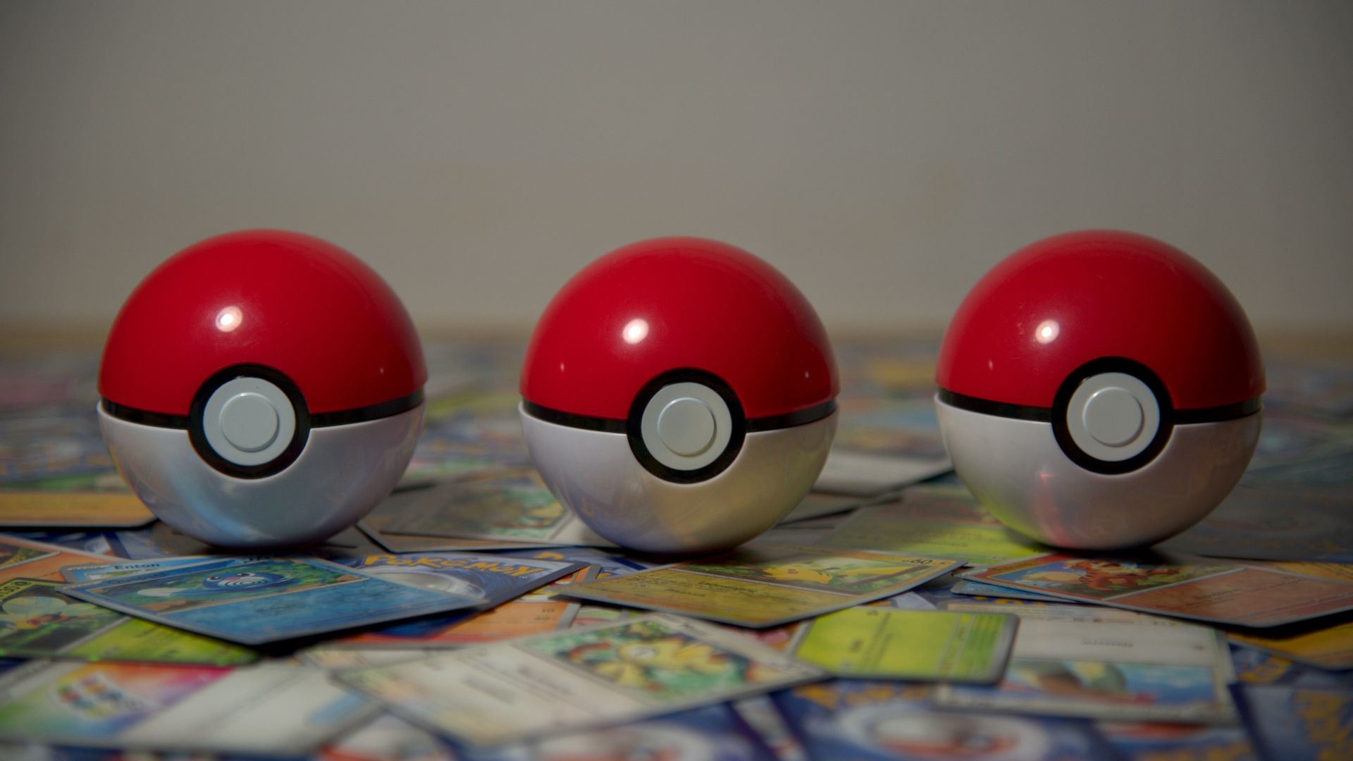 three pokemon balls sitting on top of a table