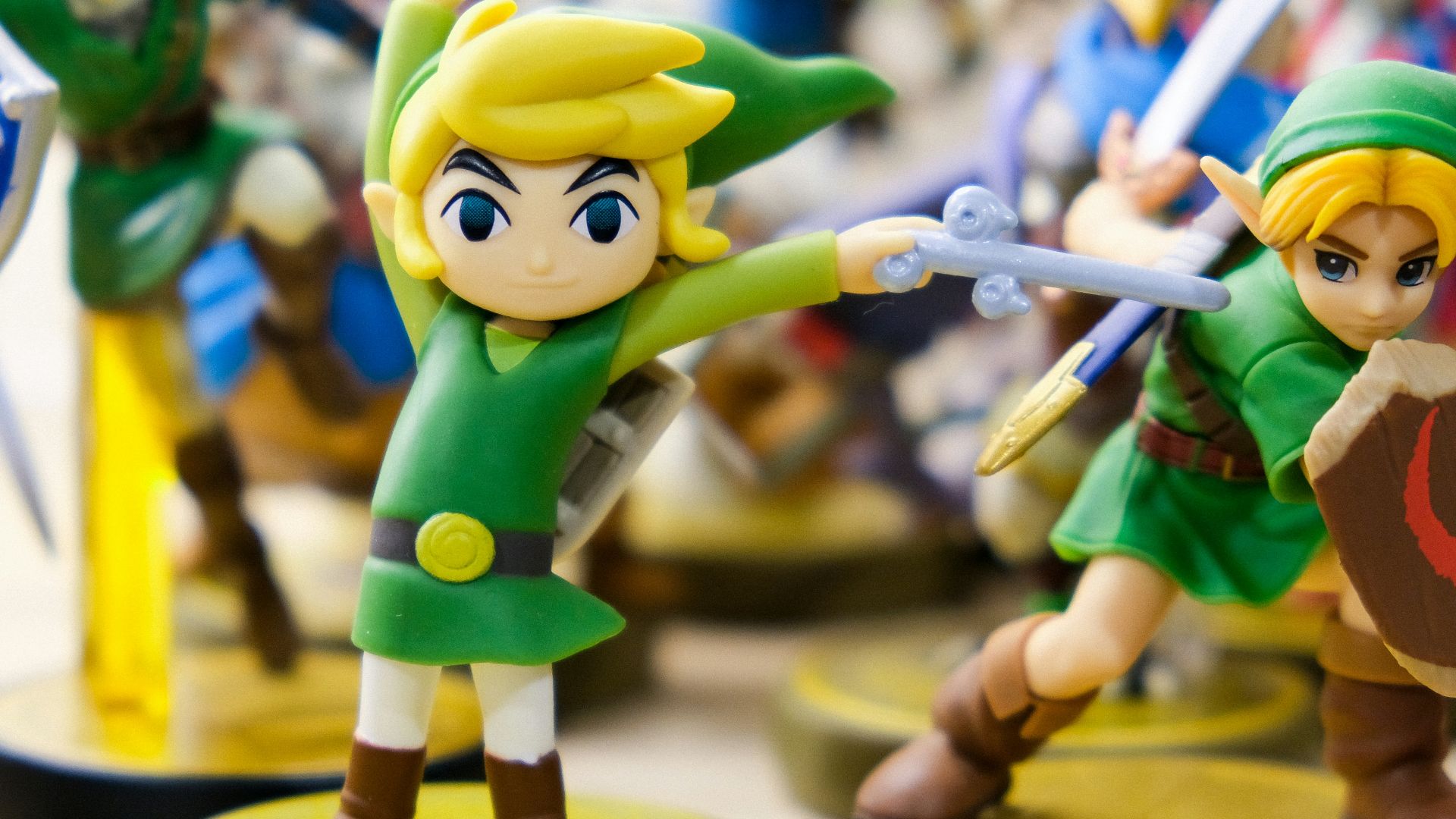 selective focus photography of Link vinyl figures