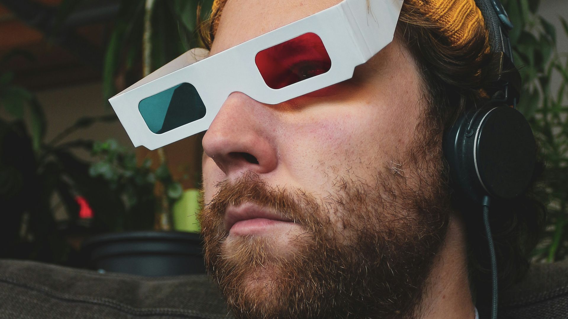 man in black crew neck shirt wearing white sunglasses and headphones
