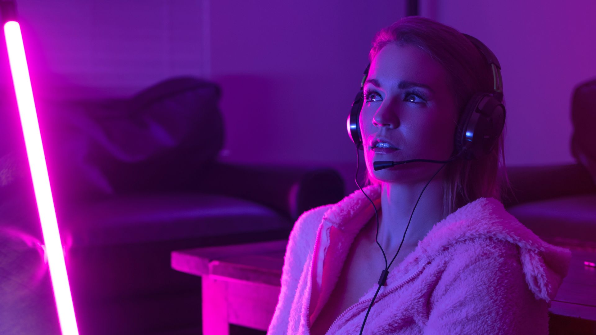 woman in white robe sitting on couch