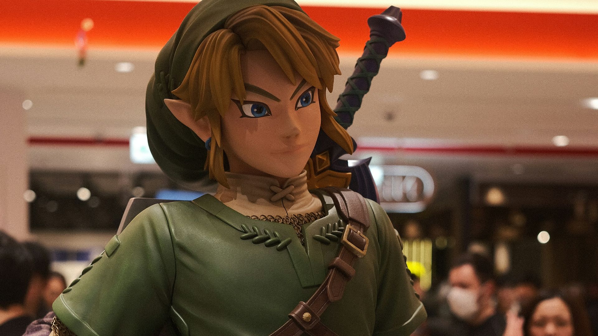 a statue of a woman in a green outfit