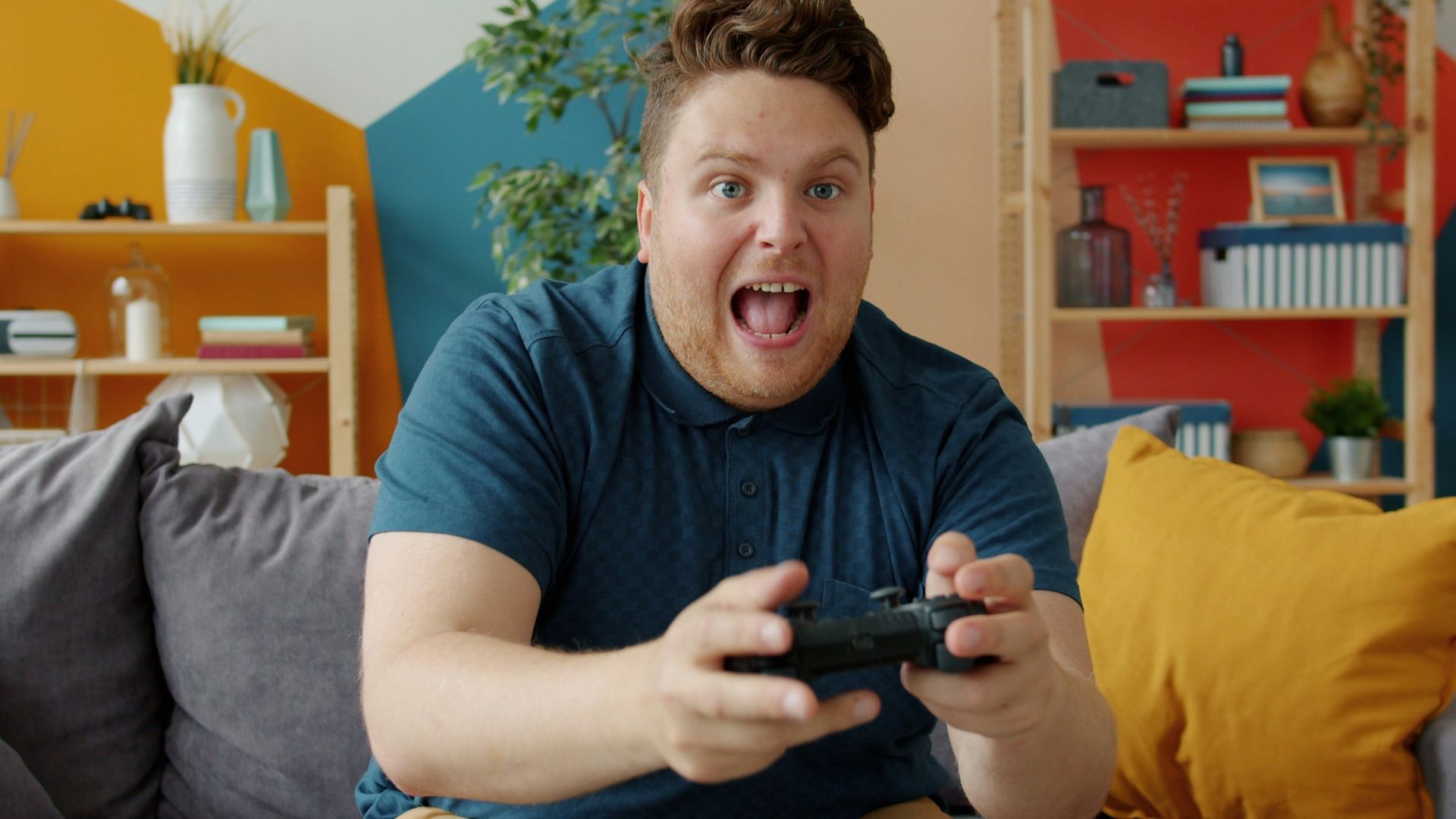 Man playing video games with excited expression
