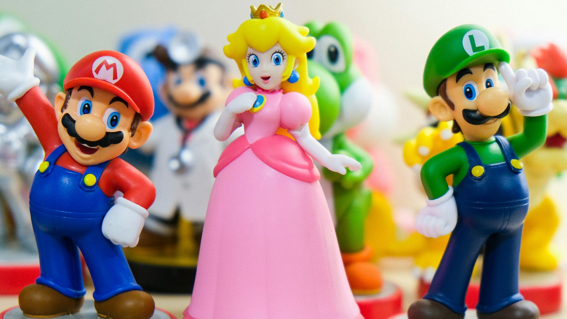 Super Mario, Luigi, and Princess Peach figurines