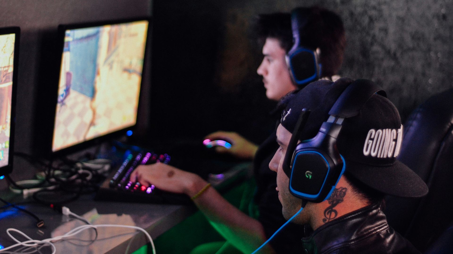 two men playing PC games