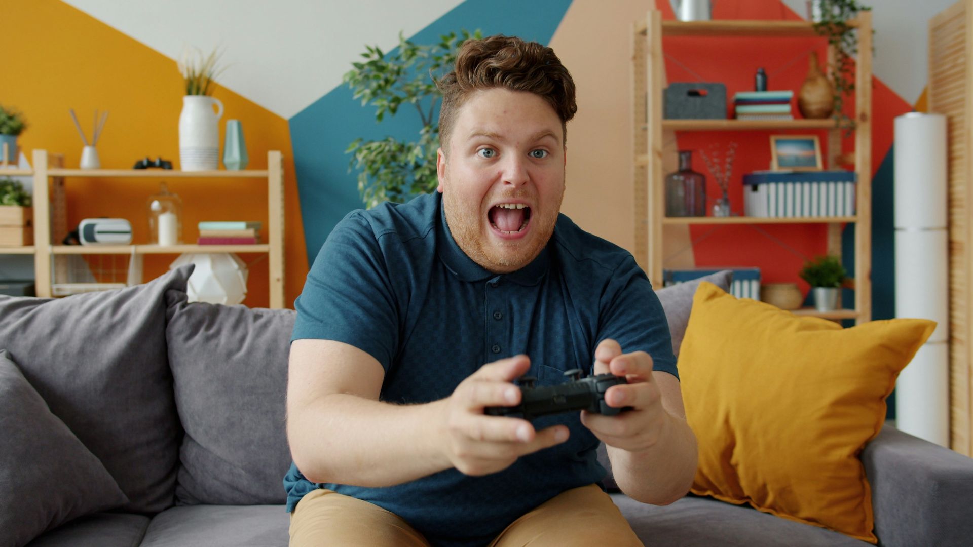 Man playing video games with excited expression