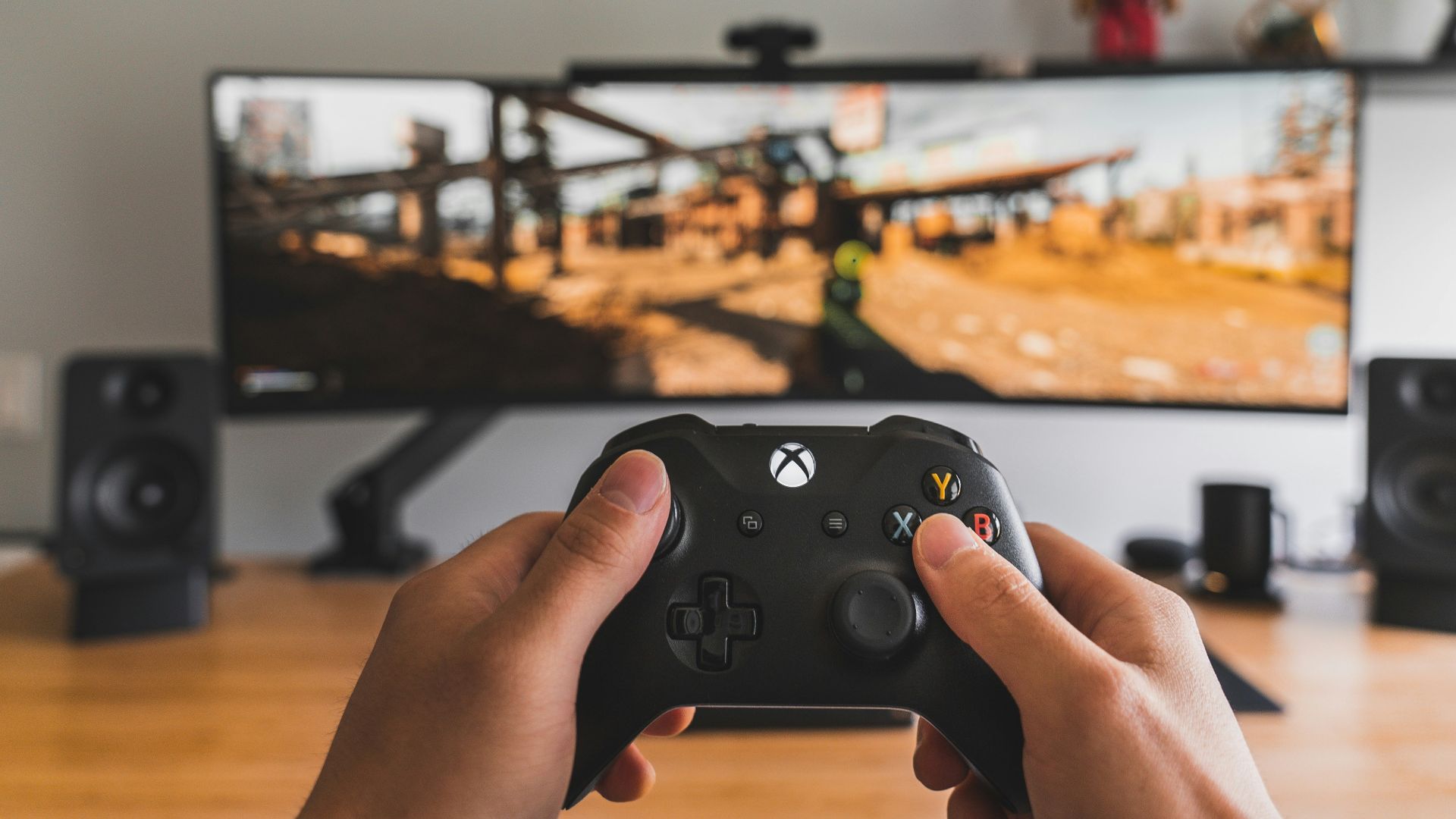 person holding black game controller