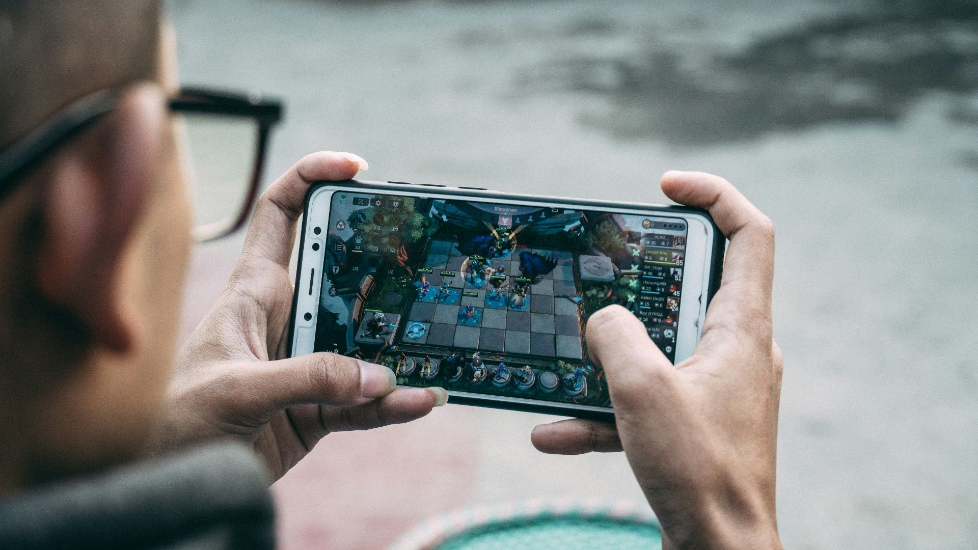 a man is playing a game on his phone