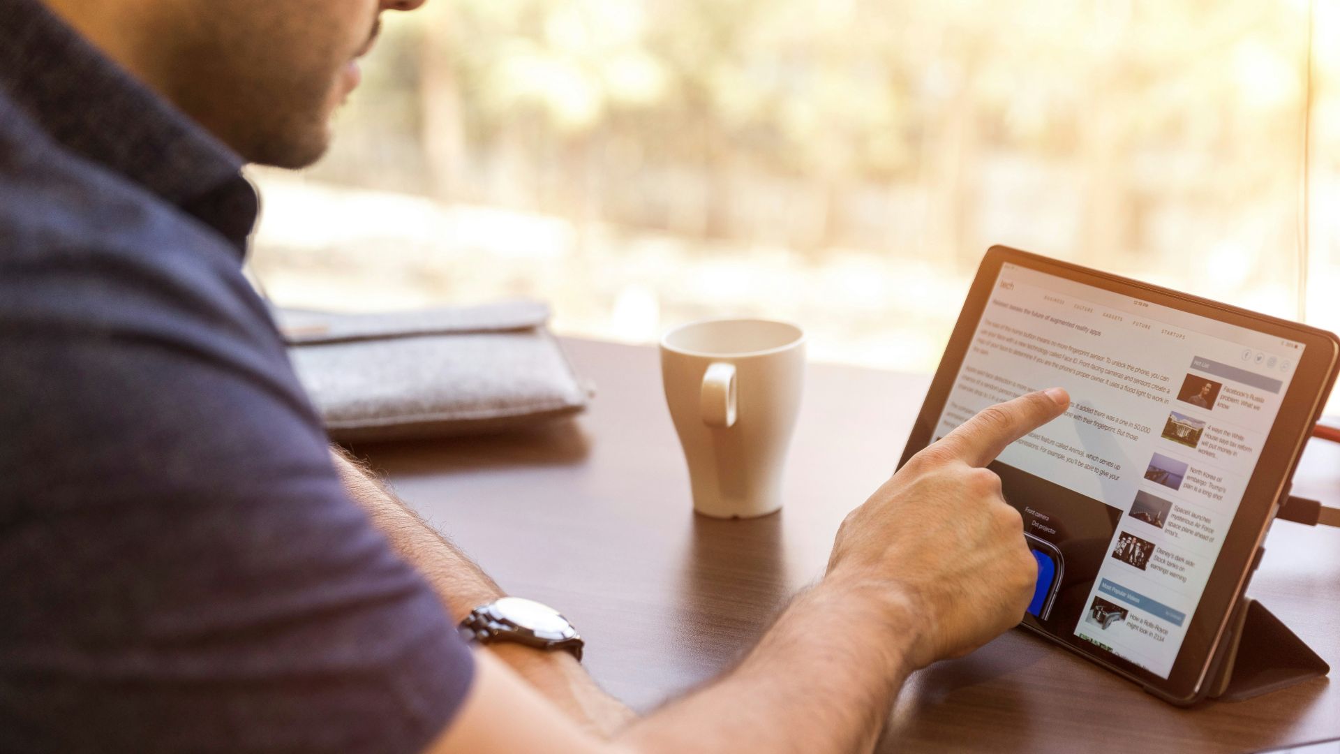 man holding tablet computer