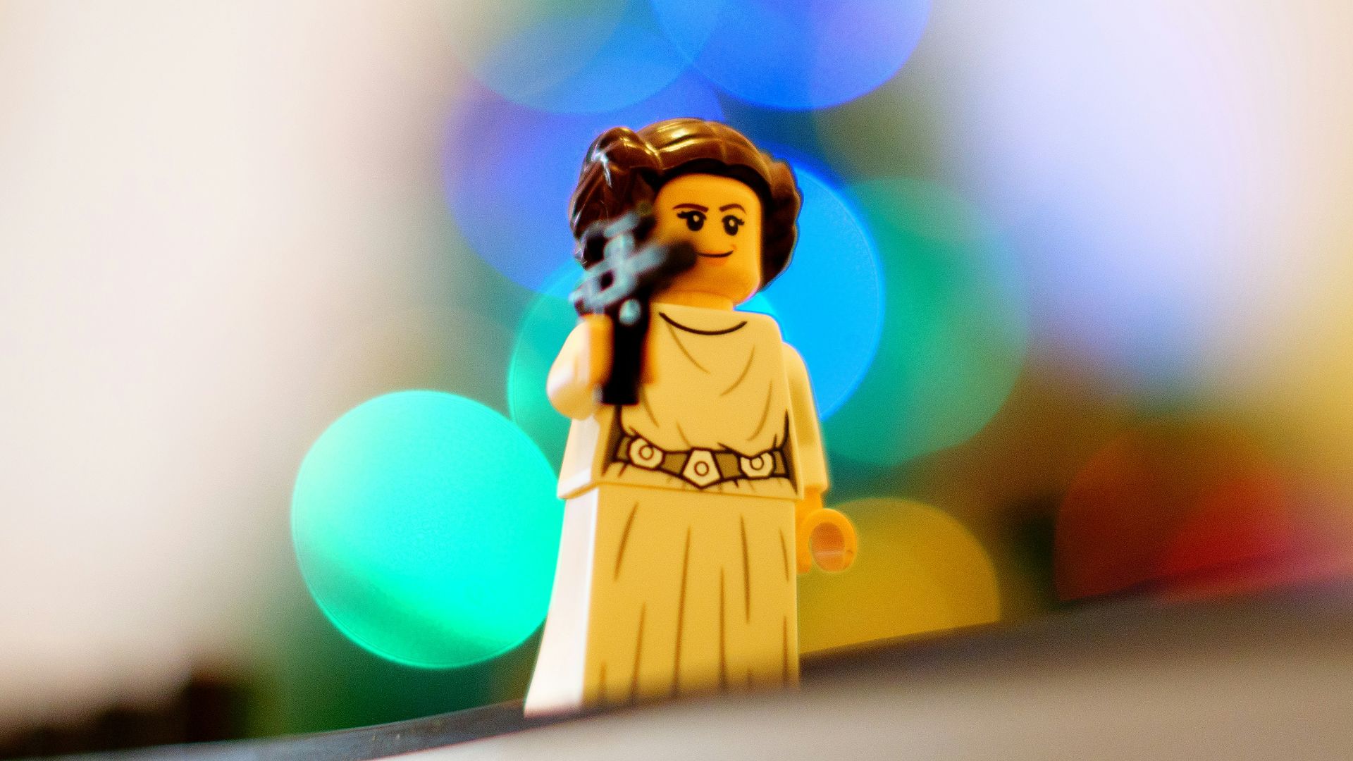 a lego star wars character holding a gun