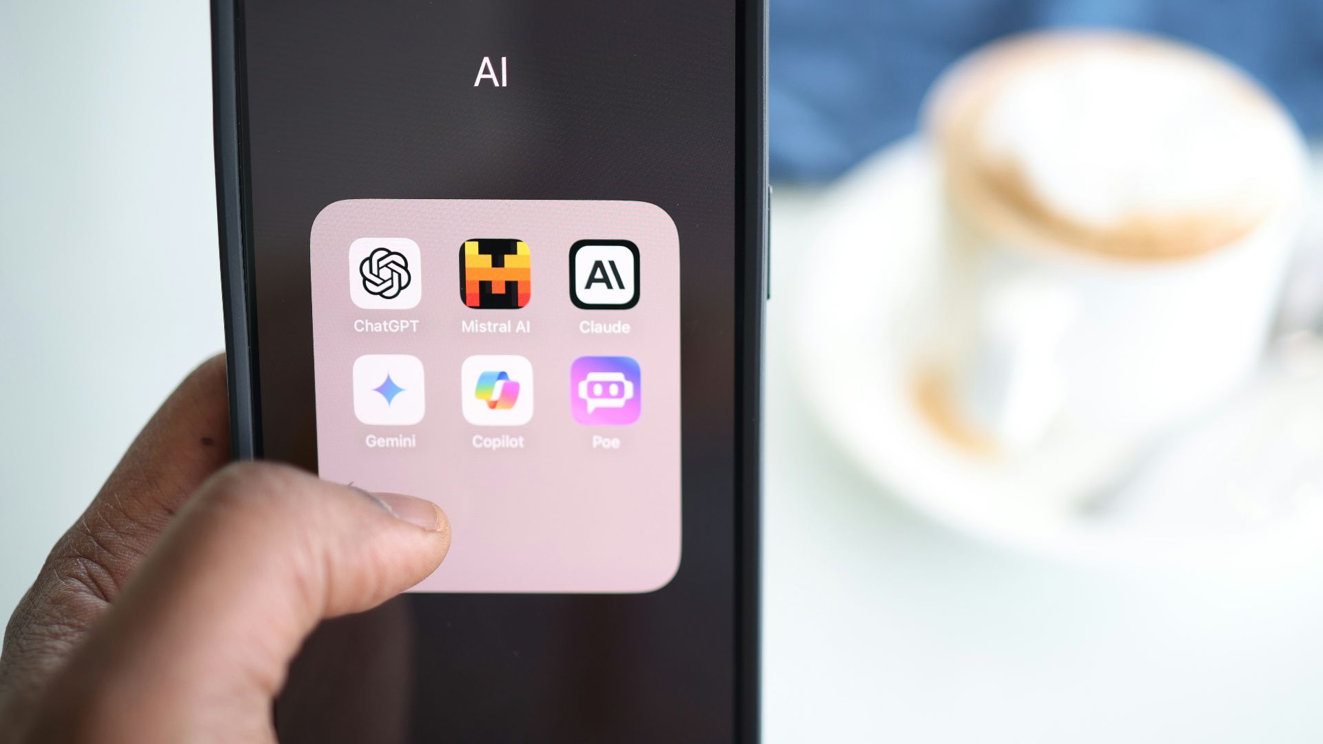 a person holding a cell phone in their hand